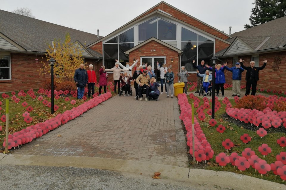Members of the community along with staff and residents at the Atrium Retirement Residence made lawn poppies to mark Remembrance Day.