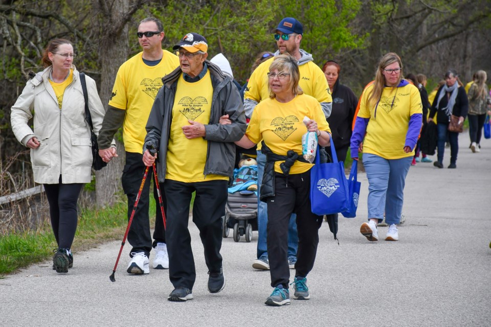 Neill Latter, centre, 94, is joined by his walking buddy leading a group of walkers at Sunday’s Hike for Hospice Orillia at Tudhope Park.