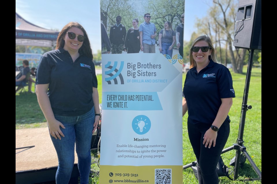 Haleigh Payne, left, fundraising and community development co-ordinator for Big Brothers Big Sisters of Orillia and District, and executive director Miranda Chaffey are shown during the Big Barbecue event at Tudhope Park on Saturday.