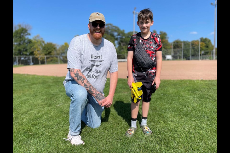 David Ward, a volunteer with Big Brothers Big Sisters of Orillia and District, spent time with his match, Declan Parker, during an event at Tudhope Park on Saturday.