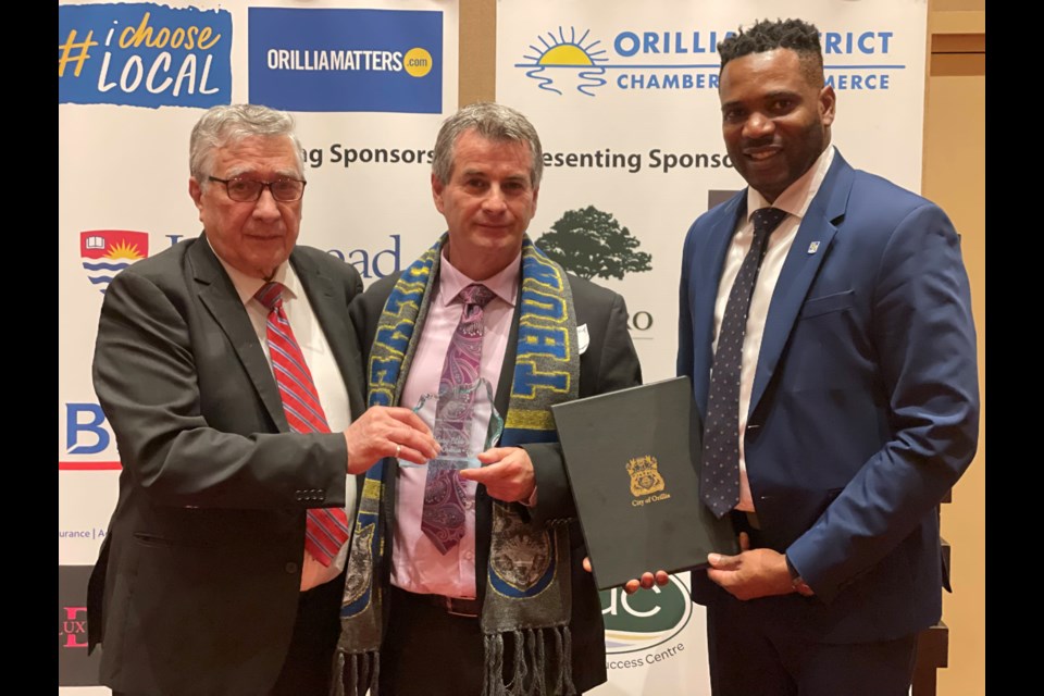 Ralph Cipolla, Allan Lafontaine, and Orett Douglas accepted, on behalf of Orillia's Rotary Club, one of three Chris Bellchambers awards on Thursday night. 