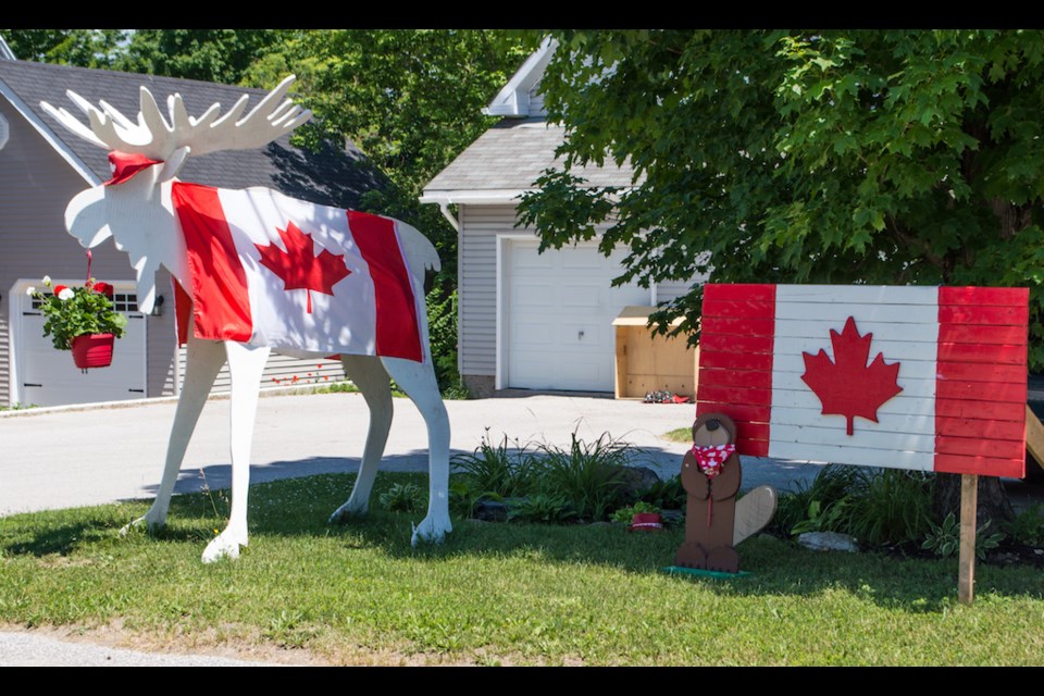A life-sized Canadian moose and beaver on Peter Street North represent the patriotic Canadian spirit in Orillia. Tyler Evans/OrilliaMatters.  
