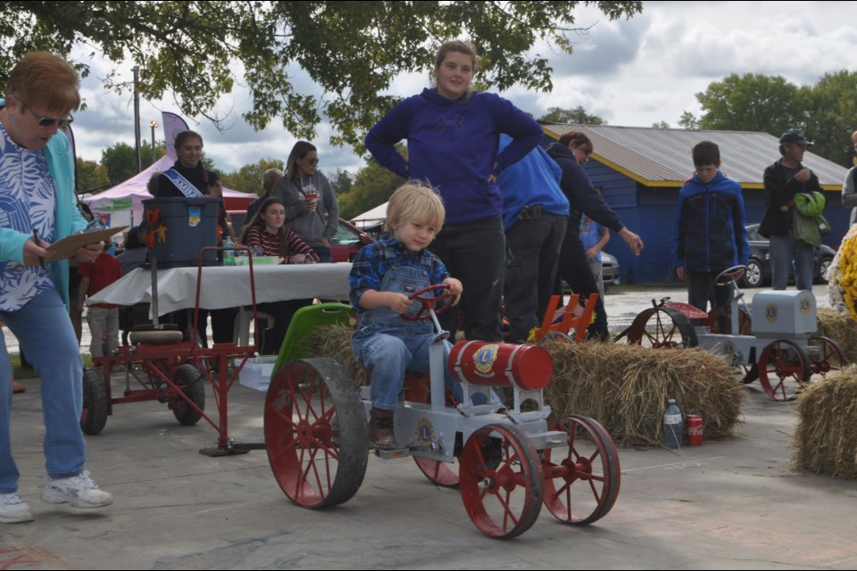 Three-year-old Linkon Faulkenham enjoys the trailer pull at the Coldwater Fall Fair Saturday afternoon. Andrew Philips/OrilliaMatters