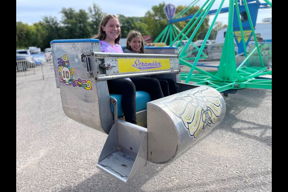 Ana and Elizabeth were happy to see the midway back at the Coldwater Fall Fair on Saturday.