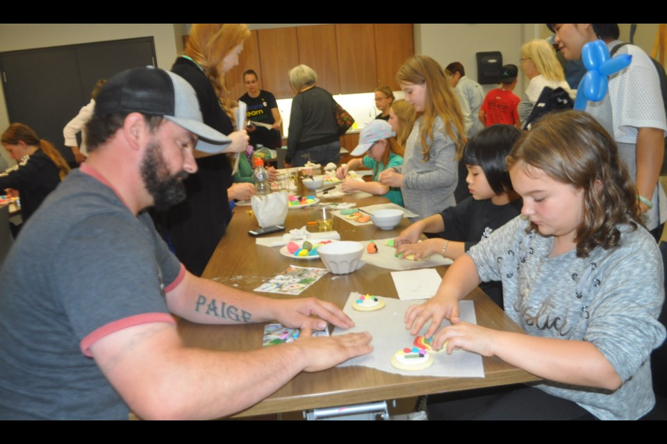Jon Baron and his 10-year-old daughter Payton decorated cookies during one workshop at Saturday How-to Festival at the Orillia Public Library. Andrew Philips/OrilliaMatters
