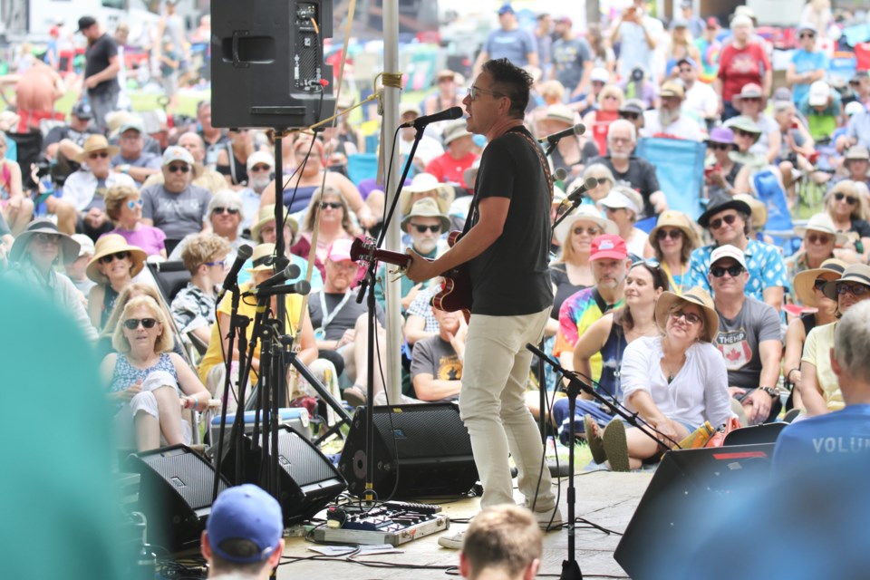 Danny Michel sings to a large crowd Saturday on the second day of the 2023 Mariposa Folk Festival at Tudhope Park.