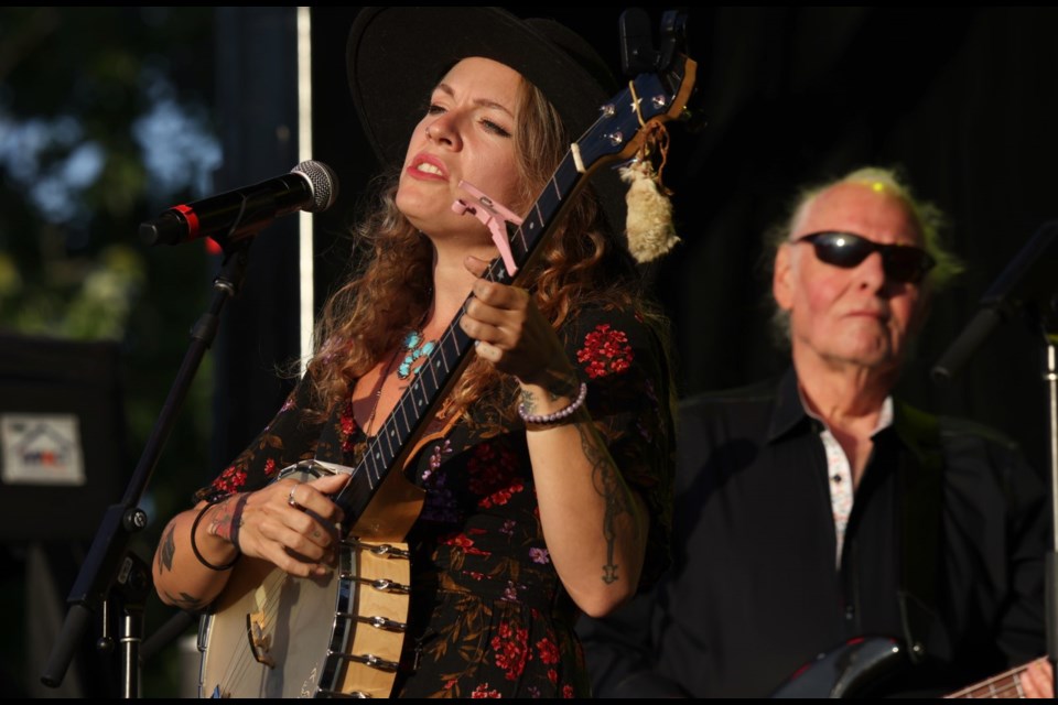 Meredith Moon, daughter of Gordon Lightfoot, performs with Rick Haynes, a longtime Lightfoot bandmate during a tribute to the late Canadian folk icon Sunday night.