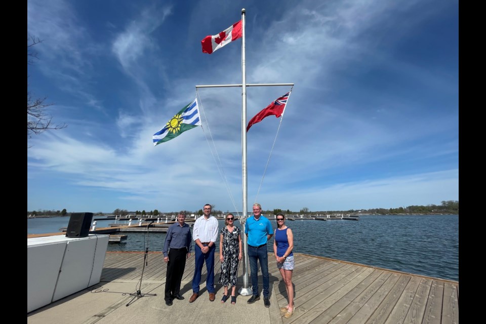 The flags at the Port of Orillia have been raised, signifying the official start of boating season in the Sunshine City. From left are Orillia District Chamber of Commerce (ODCC) executive director Allan Lafontaine, Coun. Mason Ainsworth, ODCC president Raquel Ness, Mayor Steve Clarke and Simcoe North MPP Jill Dunlop.