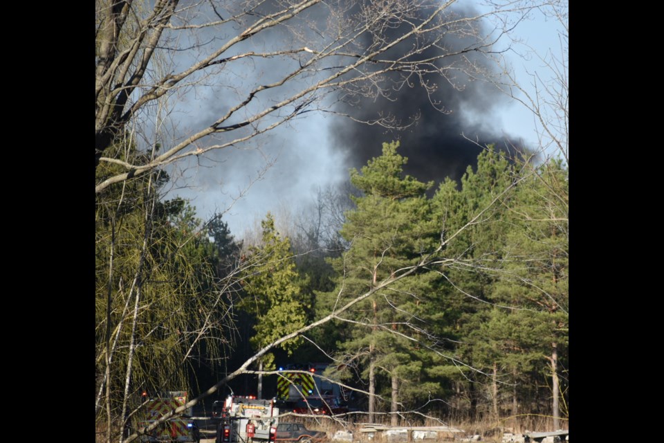 A fire erupted Friday evening in the brush area behind a workshop on Line 5 South in Oro-Medonte Township.