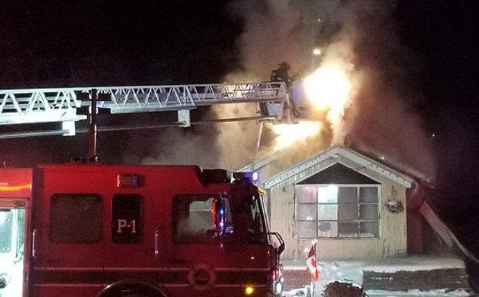 Firefighters are battling a blaze at a house on High Street Saturday night. As of 10 p.m., the fire was still burning, but reports indicate the occupants and their family dog escaped the blaze.
