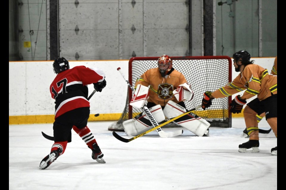 The Orillia Fire Department (red) took on Rama Fire and Rescue Services in the Ishkode Cup hockey tournament on Saturday at the Mnjikaning Arena Sports Ki.