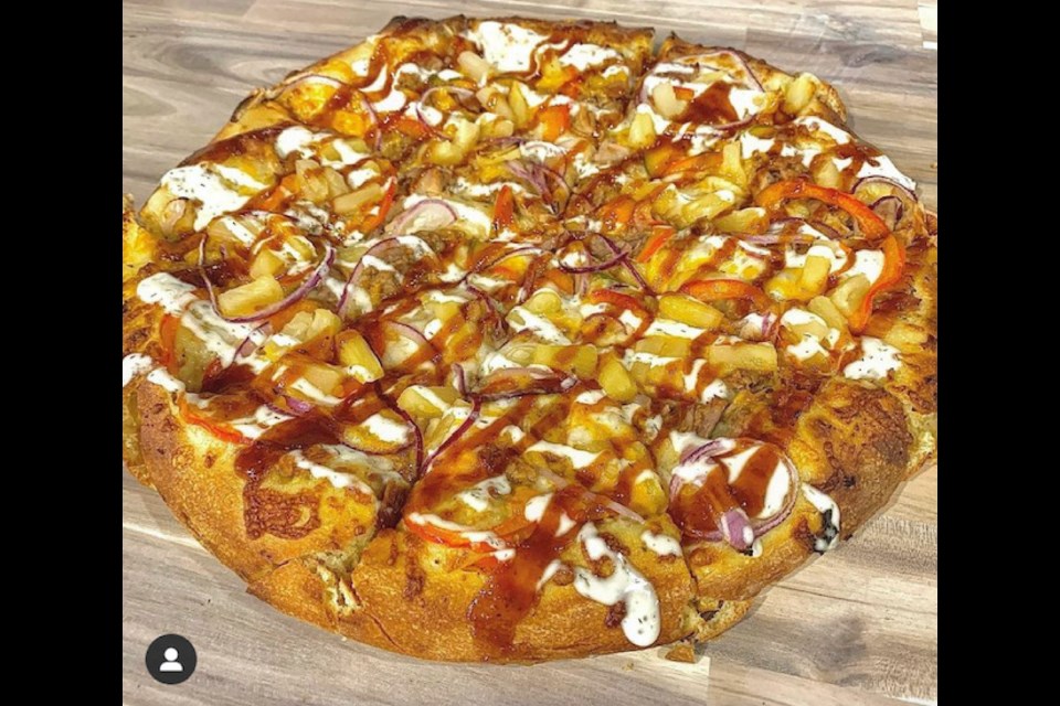 Tops in Pizza offers a variety of pies, including the gourmet pulled pork.