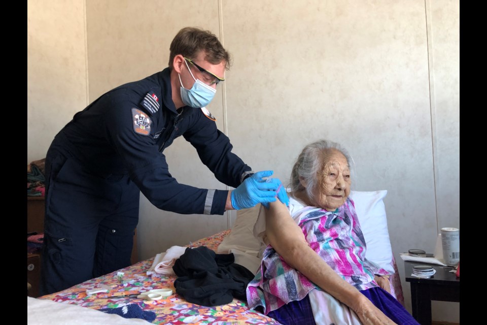 An Ornge paramedic vaccinates an Indigenous elder in Mishkeegogamang during Operation Remote Immunity. A team from Georgian College will participate in the operation from March 22 to 26. (Photo courtesy of Ornge)