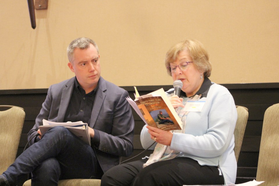 Evelyn Pollock reads from her son's memoir during the Care Connections Forum on Thursday at Casino Rama, while event facilitator Peter MacLeod listens. Nathan Taylor/OrilliaMatters