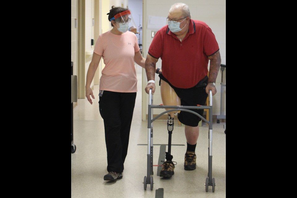 Nancy Lovatt, left, a physiotherapist, works with Roy Telford, who is using the rehab day hospital to learn how to walk and use his prosthetic leg. An upcoming fundraiser is looking to raise money to support the rehab facility at OSMH.