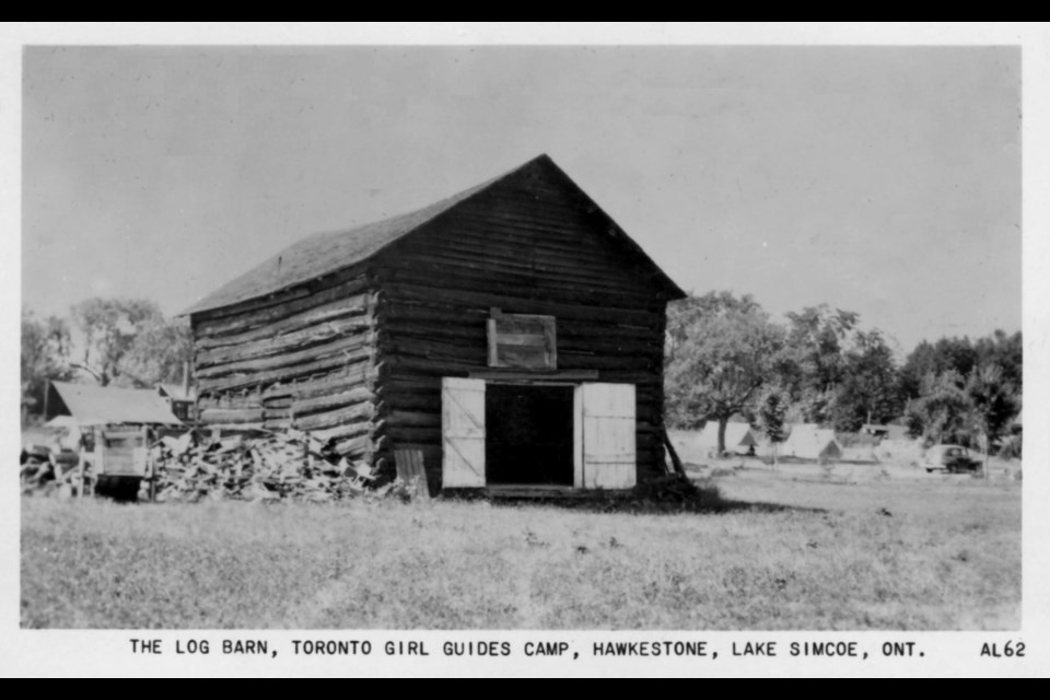 The log barn in Hawkestone is shown circa 1960.
