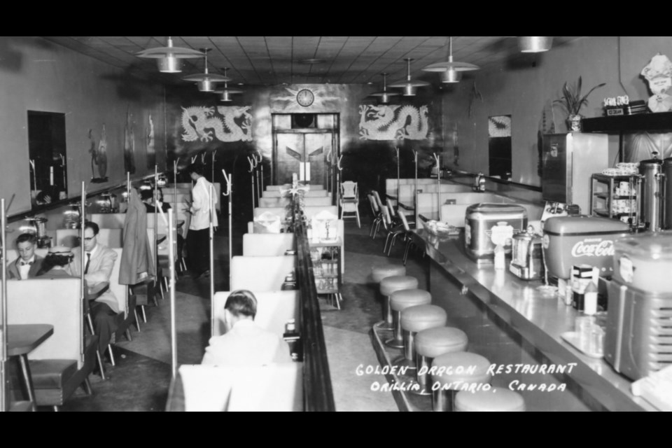 This interior black and white photo was taken inside the Golden Dragon shortly after renovations in 1952. Note the vintage Coca Cola and Canada Dry soda dispensers.

