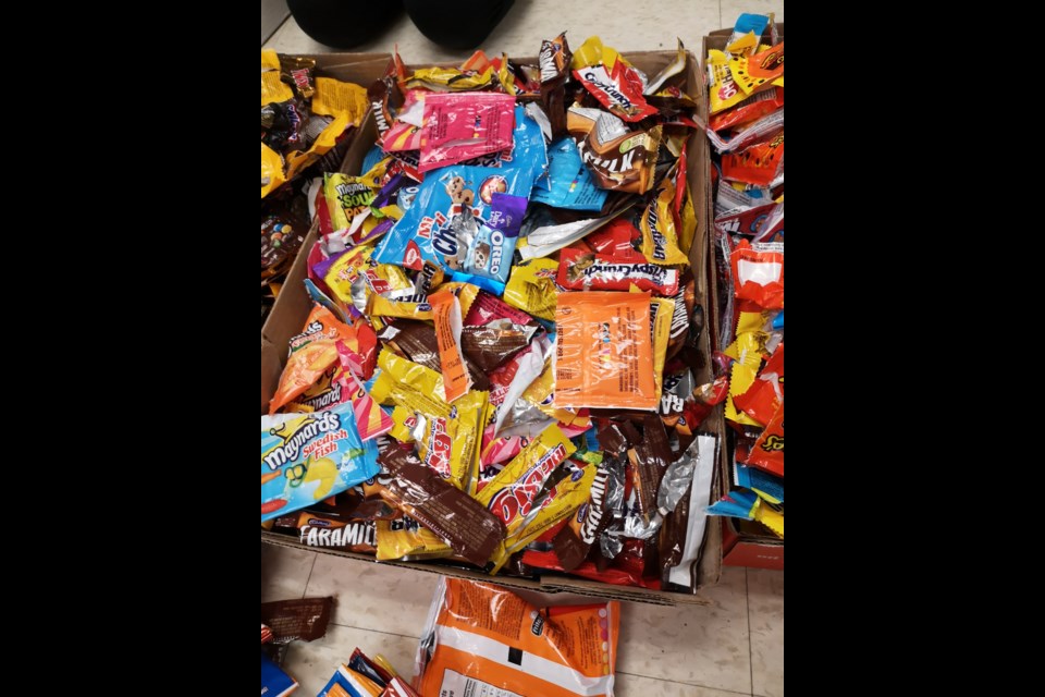 A box of candy wrappers produced by Mondelez, was sorted by Grade 7 students at Regen Park Public School to be mailed back to the manufacturer along with persuasive letters urging more environmentally-friendly packaging. 