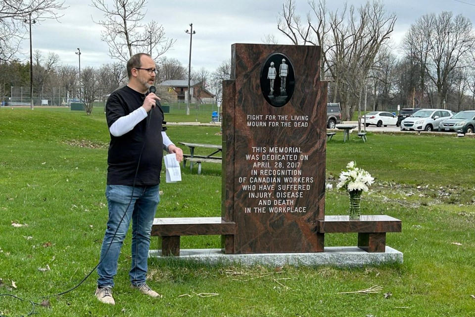 NSMDLC president Mike De Rose speaks with local advocates and community members, as they mark the Workers' Day of Mourning at Tudhope Park