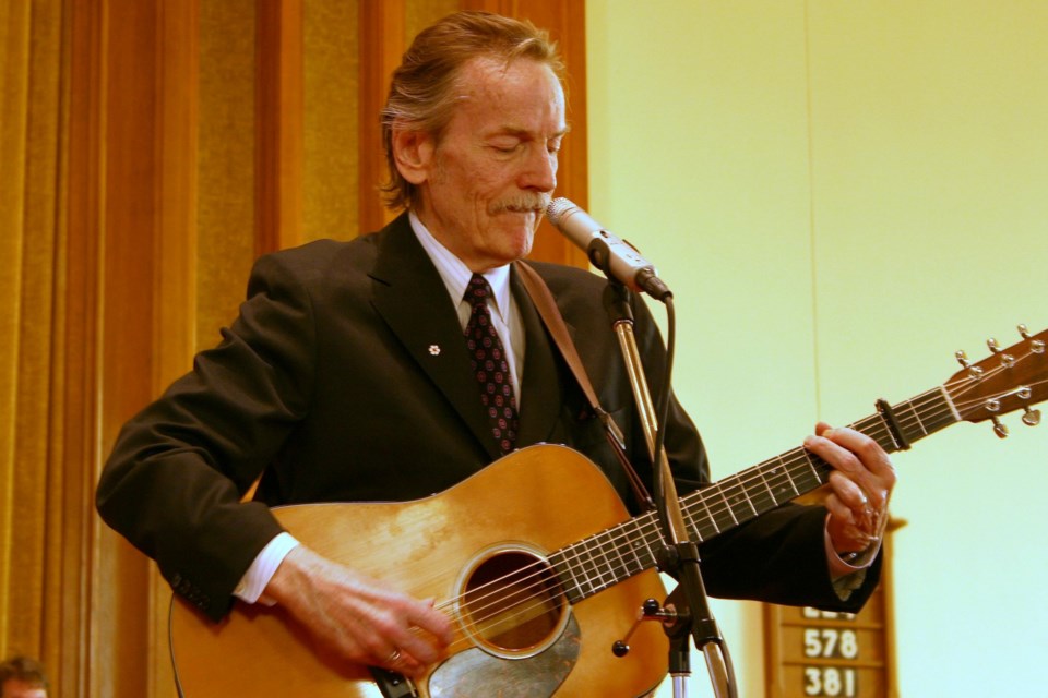 Gordon Lightfoot plays the guitar while performing during a visit to St. Paul's in 2007. The church is hosting a service, open to the public, for the legendary singer who died May 1.