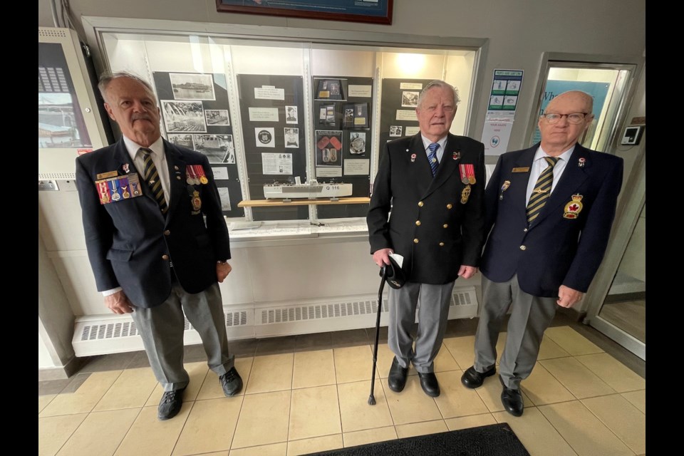 This display at the Royal Canadian Legion Orillia Branch 34 commemorates the Fairmile boat explosion of 1943. The Legion is spearheading a campaign to build a monument in Veterans' Park to honour the history. From left are president of Orillia's Branch 34, Rick Purcell, Canadian Navy veteran Len Thorne, and public relations officer Robert McCron