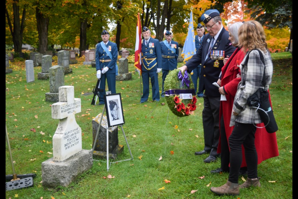 Family and Royal Canadian Legion members lay a wreath during a ceremony Thursday to mark the 79th anniversary of the death of 16-year-old Stanley Peacock, who was killed in an explosion at Hunter Boats.