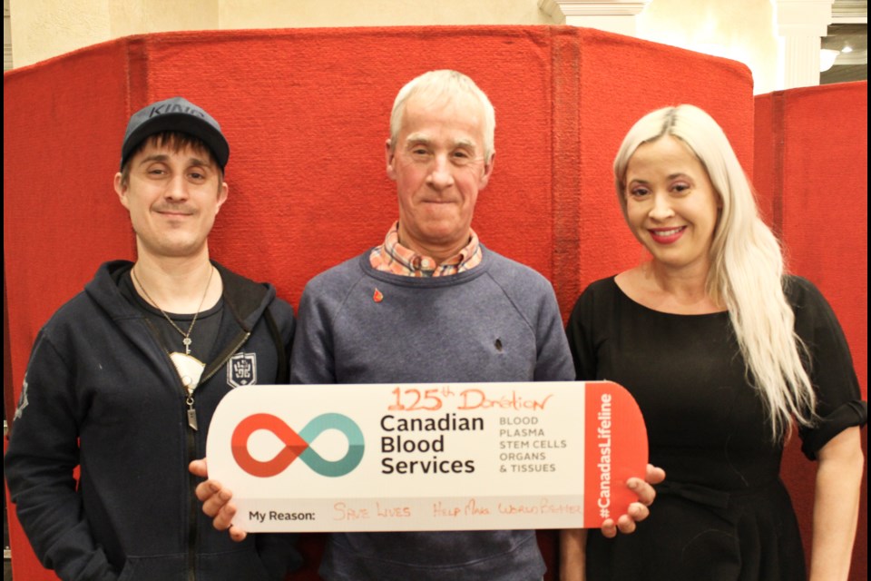 Joe Trombly made his 125th blood donation Thursday during a clinic at the Best Western Plus Mariposa Inn and Conference Centre. He was joined by his son, Chris Trombly, and daughter, Danielle Trombly, both of whom also donated. Nathan Taylor/OrilliaMatters
