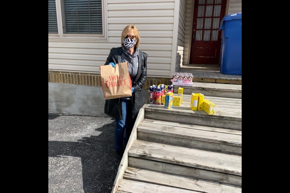 Marci Csumrik is shown with some of the food that was given to Orillia Youth Centre families on Easter weekend. Supplied photo