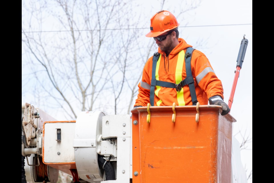 A Hydro One worker is shown.