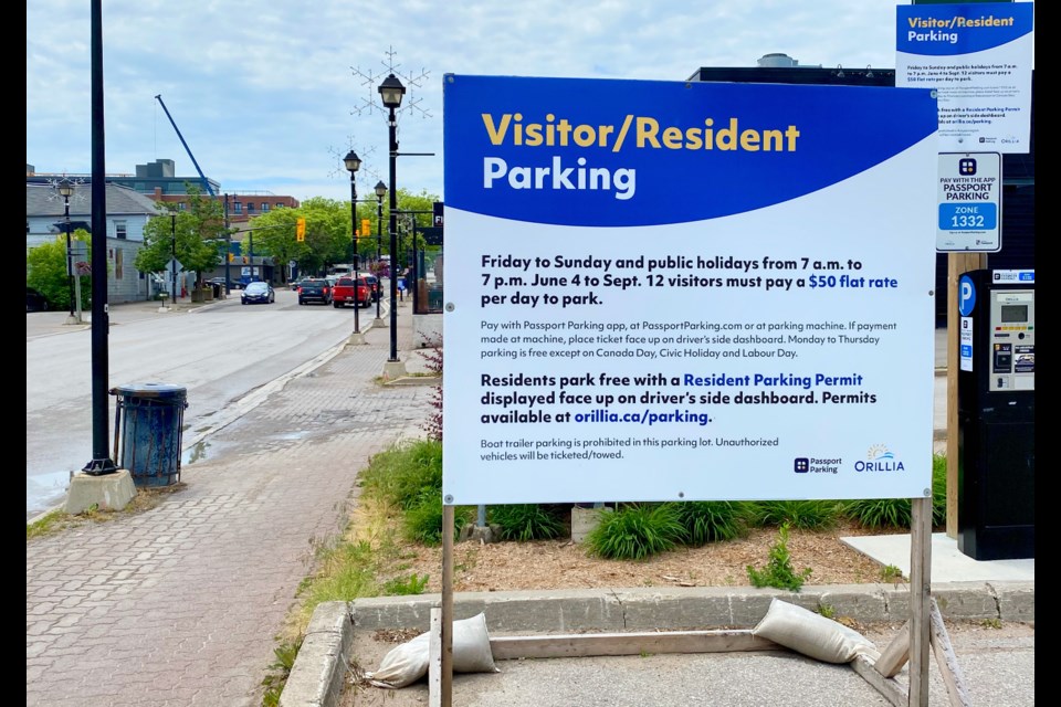 Signs are up to inform residents and visitors about the city's waterfront parking and boat launch program.