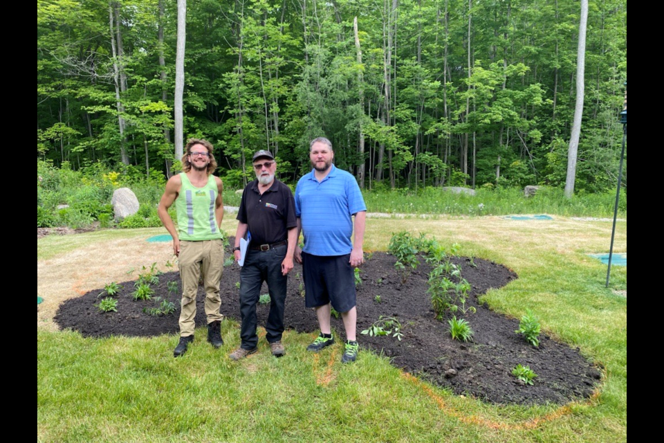 Pictured, from left, are Scott’s Garden Centre staff member Dane Cole, naturalist Bob Bowles and Mariposa House Hospice staff member Greg Muir with the butterfly garden planted this year.