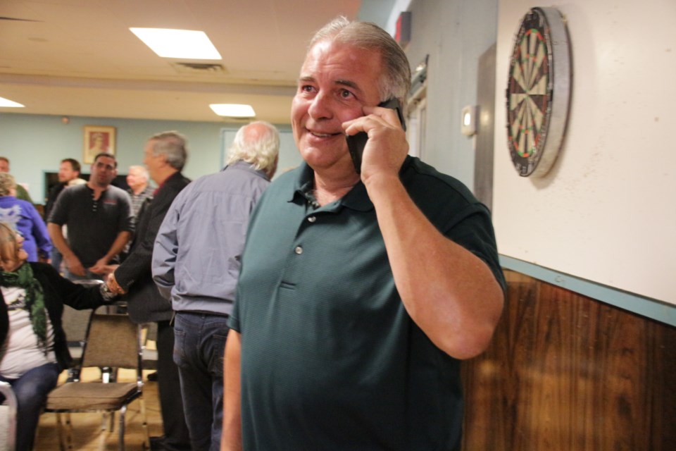 Joe Gough, newly elected councillor for Ramara's Ward 2, takes a call from a supporter after results were announced Monday night. Mehreen Shahid/OrilliaMatters