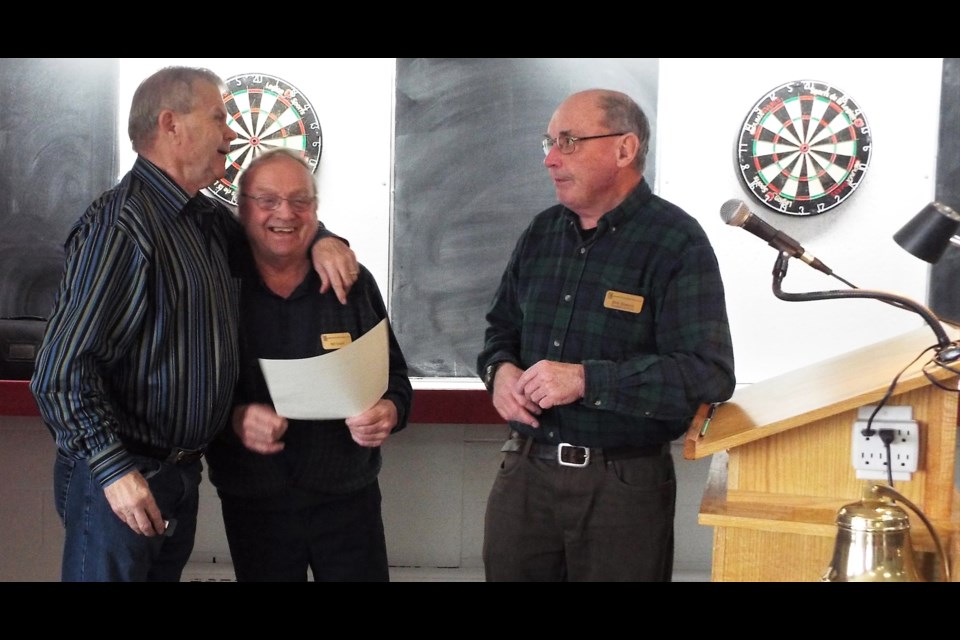 Champlain Seniors Service Club president Bob Bowles, right, and membership chair Bill Grant Induct new member Les Welch at a recent meeting. The active club is looking for new members. Supplied photo