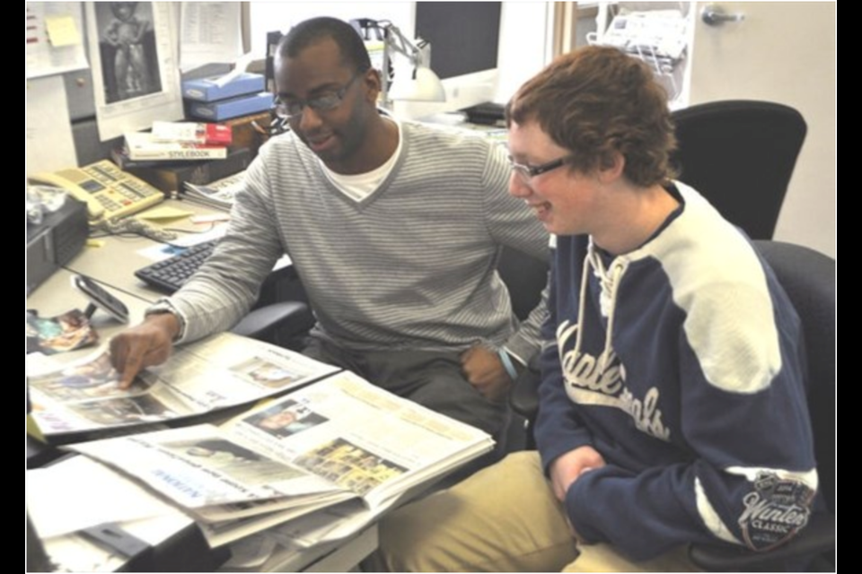 Former Orillia Packet & Times editor Michael McClymont working with former co-op student Tyler Evans. 