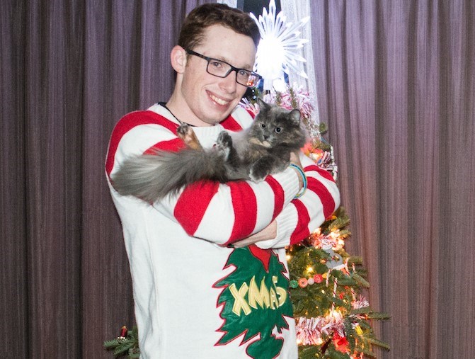 Tyler Evans with his new pet, Gozie, who helped he and his family re-discover the joy of Christmas.