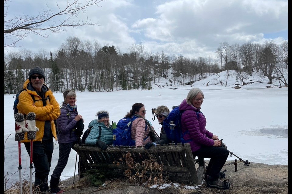 Members of the local chapter of the Ganaraska Hiking Club take a break to enjoy the view during a recent hike to Coopers Falls.