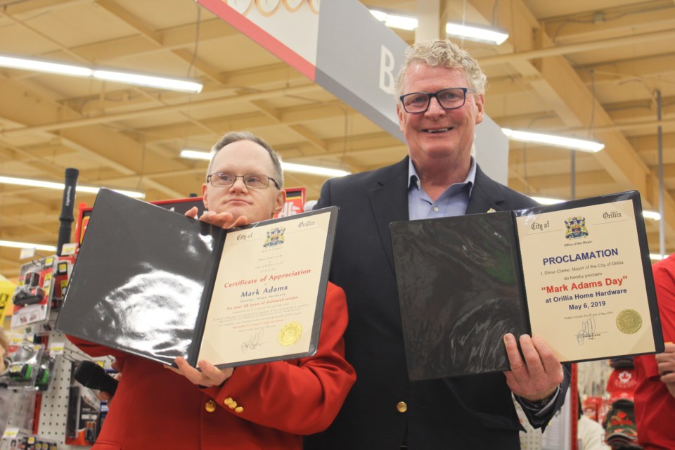 Mark Adams, left, is shown with Mayor Steve Clarke, who proclaimed May 6 to be Mark Adams Day at Orillia Home Hardware. Nathan Taylor/OrilliaMatters