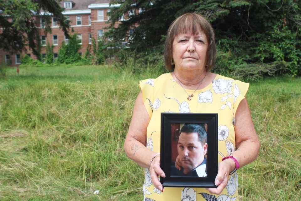 Kathy Green holds a photo of her son, David Pinkney, who died in a workplace accident in February 2017. A coroner's inquest into his death is underway in Orillia. Nathan Taylor/OrilliaMatters