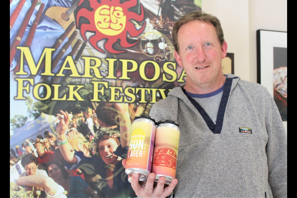 Chris Hazel, manager of the Mariposa Folk Foundation, is shown with the newly released Mariposa Sun Lager. Nathan Taylor/OrilliaMatters