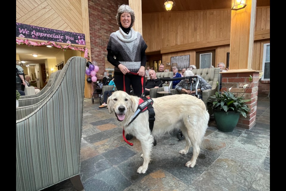 Brenda Wood and Sophie, an advanced therapy dog, volunteer weekly at the Atrium Retirement Residence on Coldwater Road.
