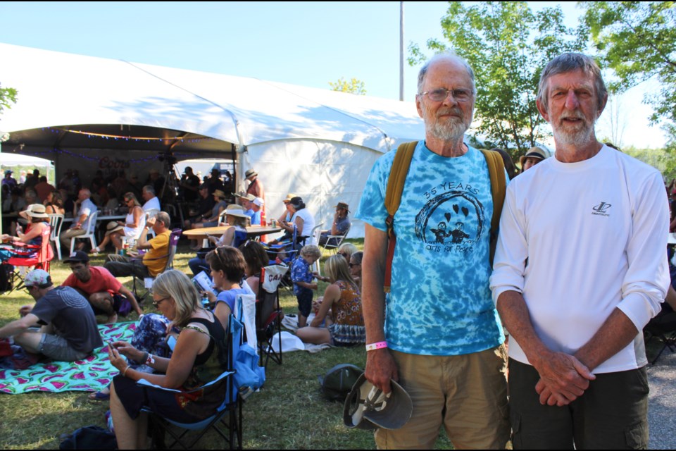 Gord Ball, left, and Tim Lauer were among a group of Orillians who led the charge to bring the Mariposa Folk Festival back to Orillia. They are pictured at the festival Sunday. Nathan Taylor/OrilliaMatters