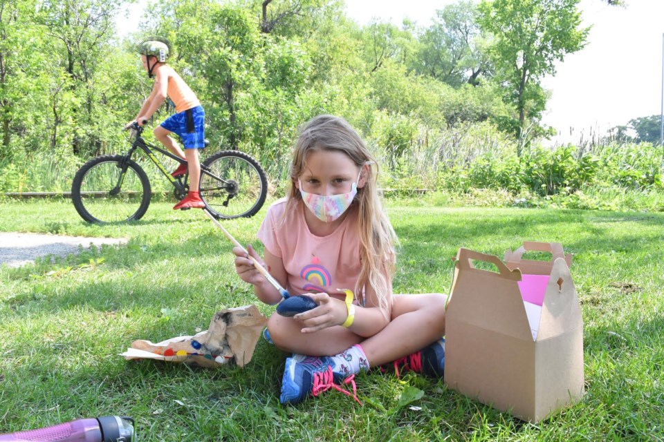 Zoe Gowanlock gets creative with an activity box in J.B. Tudhope Memorial Park. Each City of Orillia camper received their own individual art supplies for each week they are at camp.