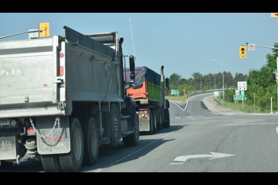The OPP is conducting a commercial truck blitz on local highways. Above, two dump trucks make their way toward Highway 11. Dave Dawson/OrilliaMatters
