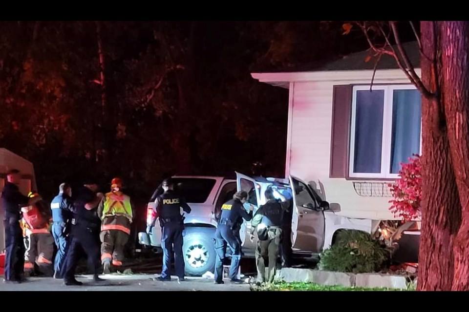 A stolen vehicle fled police and raced through Orillia before crashing into this High Street home early Saturday morning, police say.
