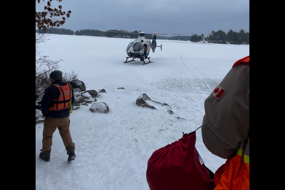 Firefighters from Southern Georgian Bay are being assisted by OPP officers and others after reports that at least two snowmobiles broke through the ice on Six Mile Lake Sunday.