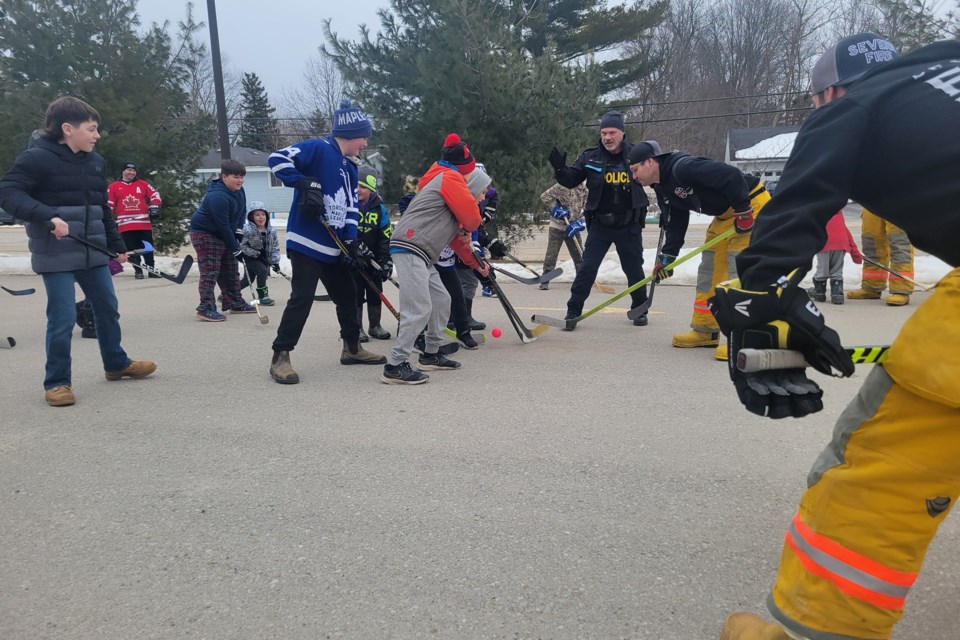First responders were slightly outnumbered at second annual road hockey game in Cumberland Beach.