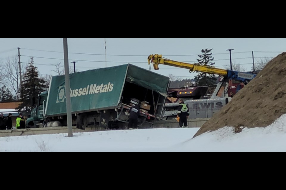 Crews are on the scene in the northbound lanes of Highway 400 at Dunlop Street, attempting to remove a truck that is stuck on the median of the highway. Some diesel fuel also spilled as a result of the incident.