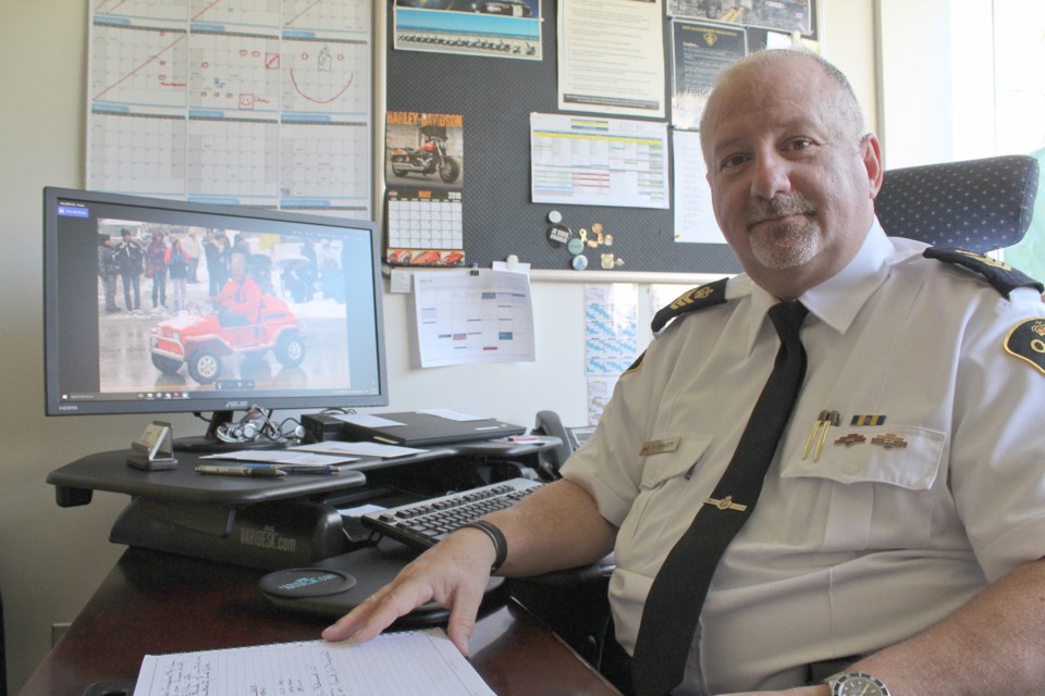 Orillia OPP Staff Sgt. Shawn Hewlett will retire at the end of May after 33 years of policing. Hewlett, shown with a picture, on his computer, of him in his Shrine car, is looking forward to becoming even more involved with the local club. Nathan Taylor/OrilliaMatters