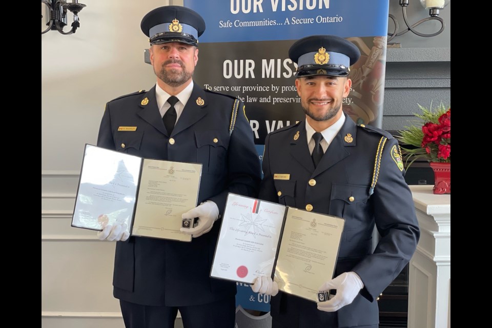Police Constable Nikolas Walmsley of Orillia and Detective Constable Benjamin Fontaine of Huronia West were honoured on Thursday for saving a man who was unresponsive following a drug overdose. 