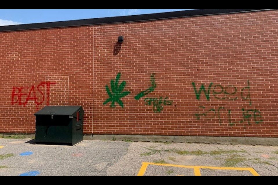 Police are looking for information after graffiti was spray-painted at Macaulay Public School in Bracebridge.